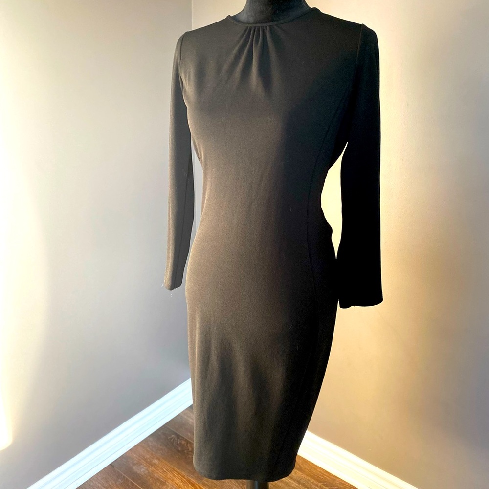 Open back below the knee beautiful classy black dress with sleeves.